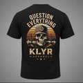 Back ghost mannequin view of the black KLYR Question Everything Tee featuring a skull wearing a hat with a desert sunset graphic and "Question Everything" design.