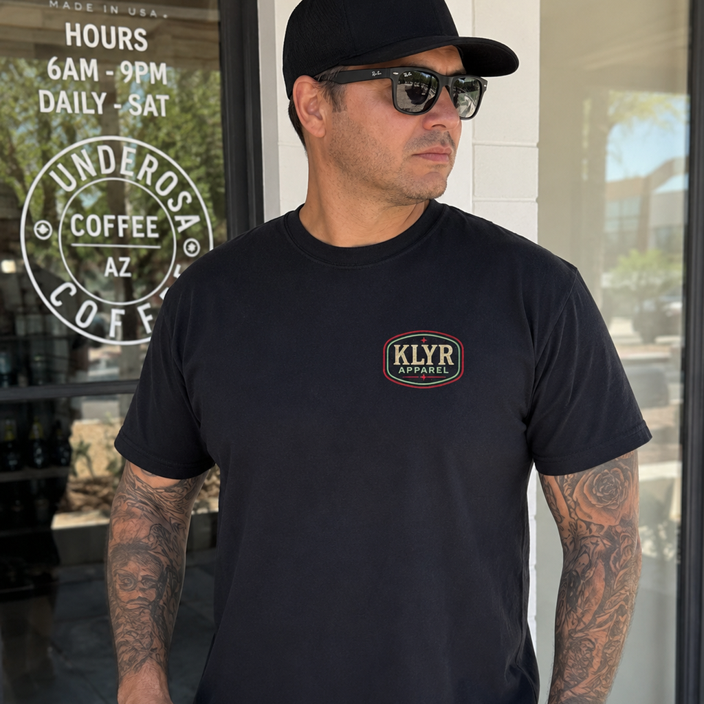 Front lifestyle view of the black KLYR Apparel After Hours Tee featuring the vintage KLYR Apparel chest logo.