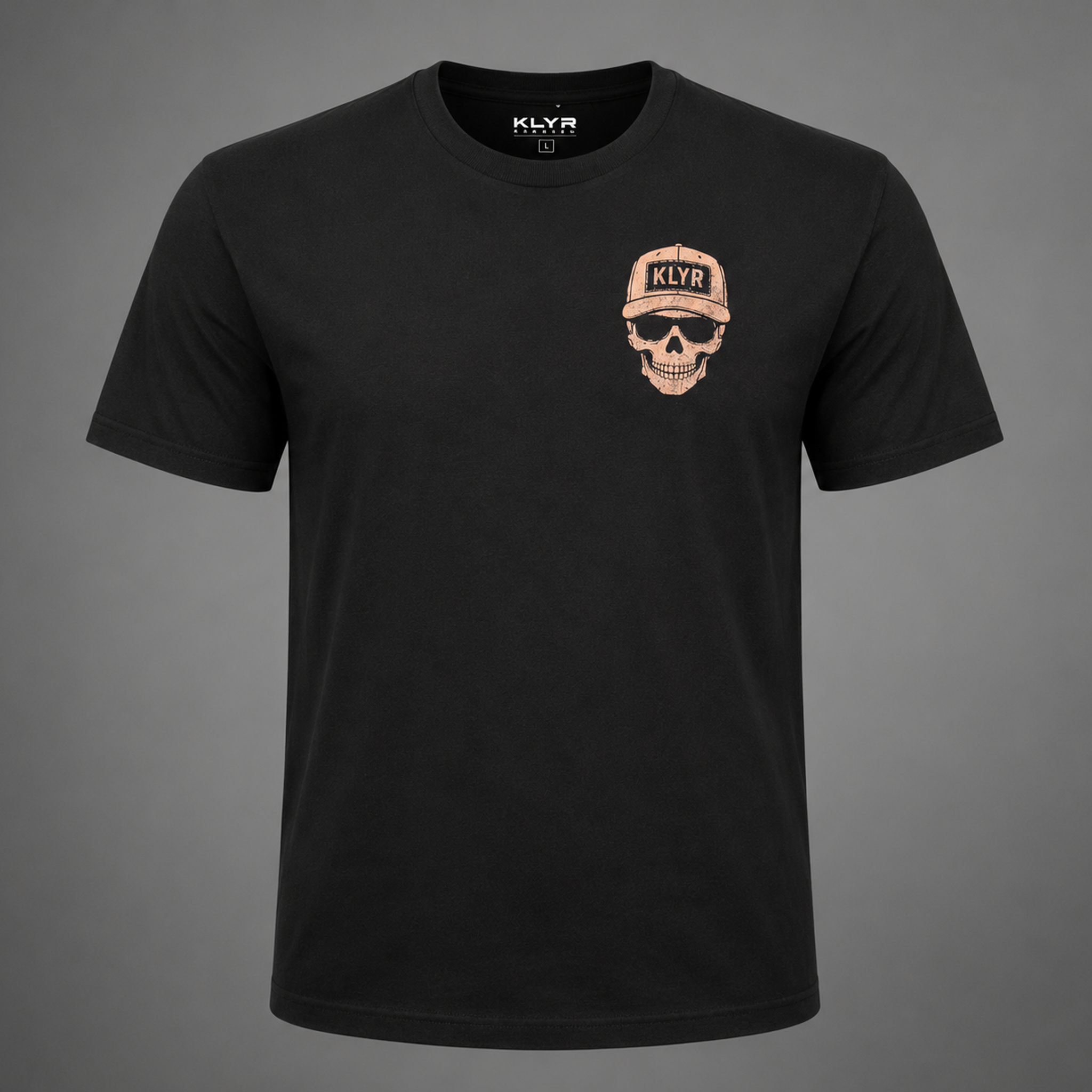 Front ghost mannequin view of the black KLYR Low Vis Tee with the skull wearing a KLYR hat chest logo.