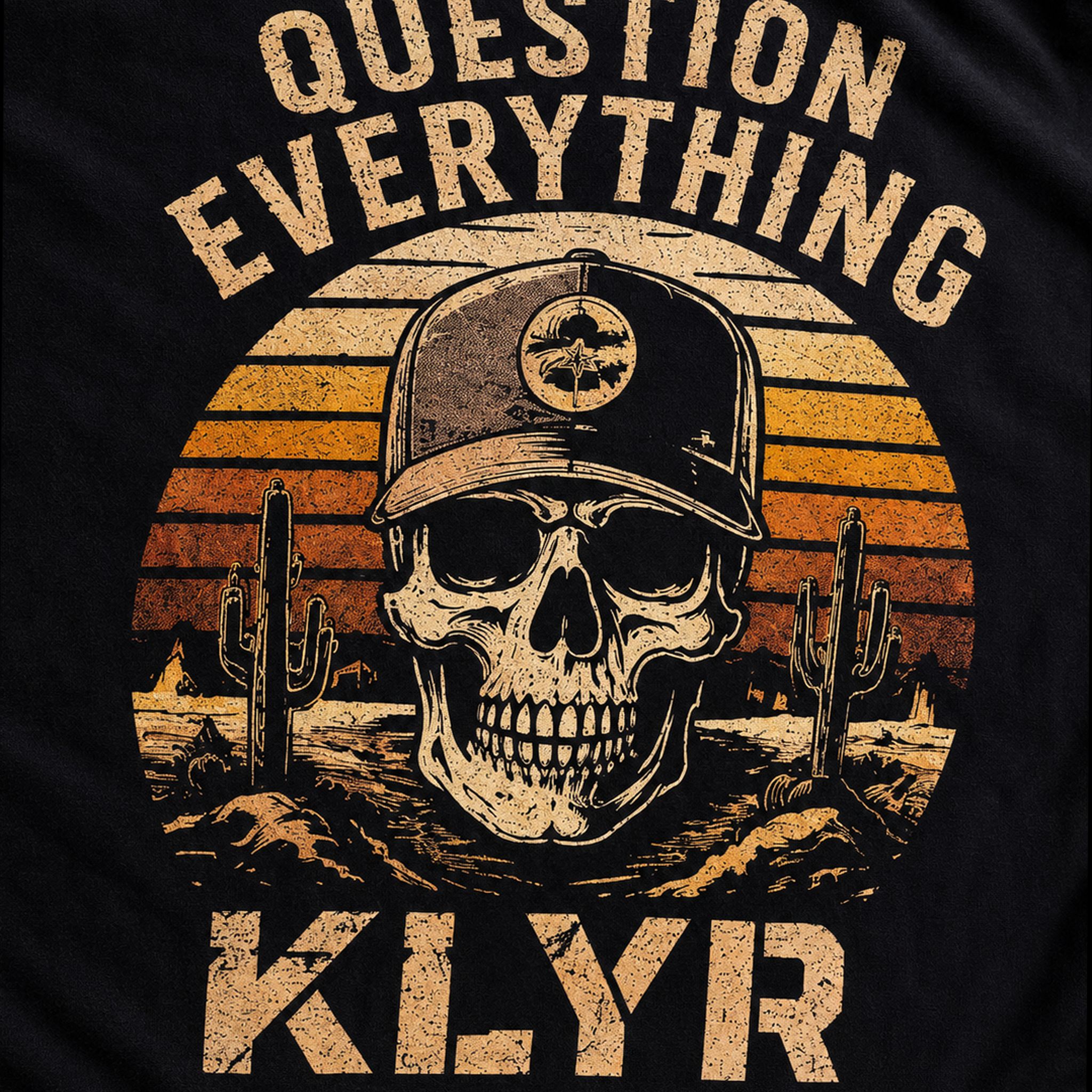 Close-up of the KLYR Question Everything Tee back graphic featuring a skull, desert sunset, cacti, and "Question Everything" artwork.