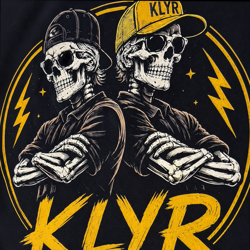 Close-up of the KLYR Homies back print featuring two skeletons, lightning accents, and distressed yellow artwork.