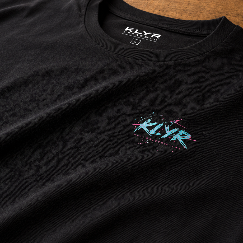 Close-up of the premium Next Level 6210 CVC fabric on the black KLYR Reality Had a Good Run Tee highlighting its soft texture and chest logo.