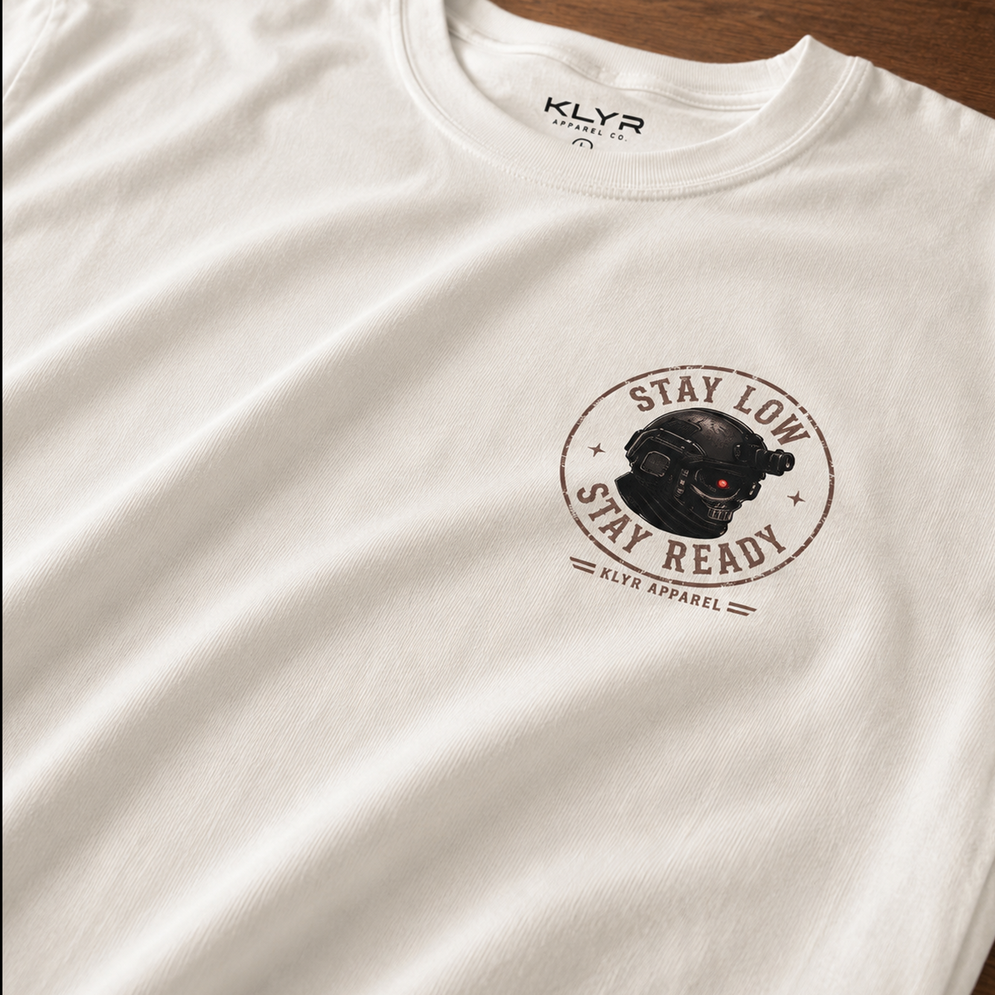 Close-up of the premium Comfort Colors 1717 fabric on the white KLYR Stay Low Stay Ready Tee highlighting its soft garment-dyed texture.