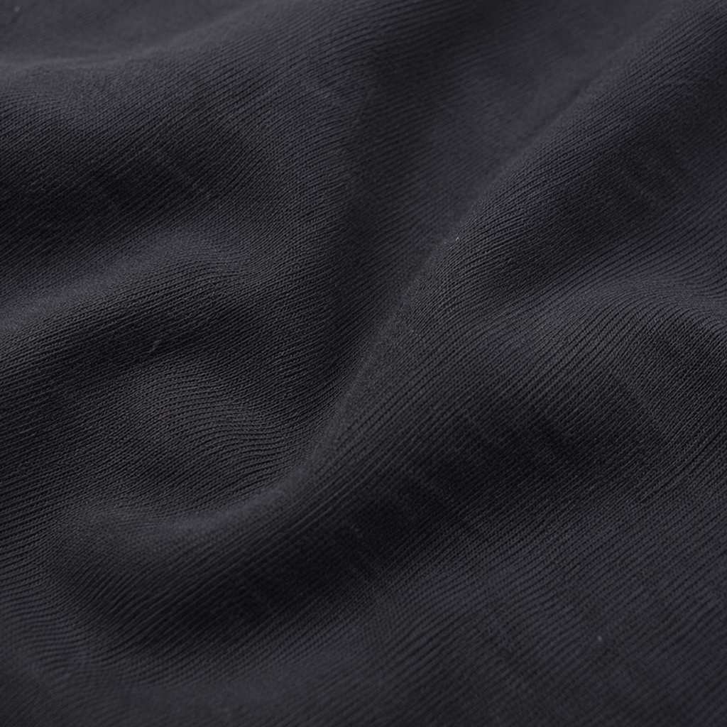 Close-up of the soft black Next Level 6210 CVC fabric used for the KLYR Homies Tee.