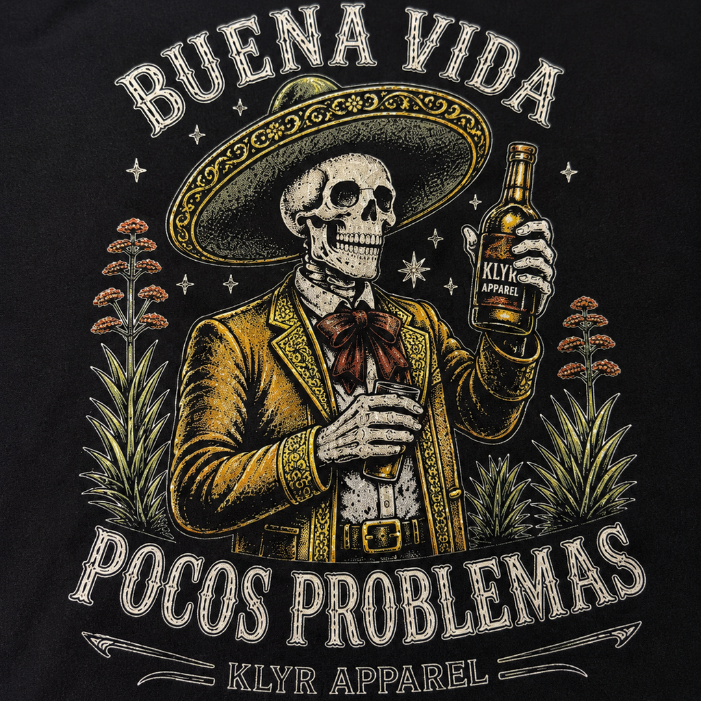 Close-up of the Buena Vida Pocos Problemas artwork designed for the black tee.