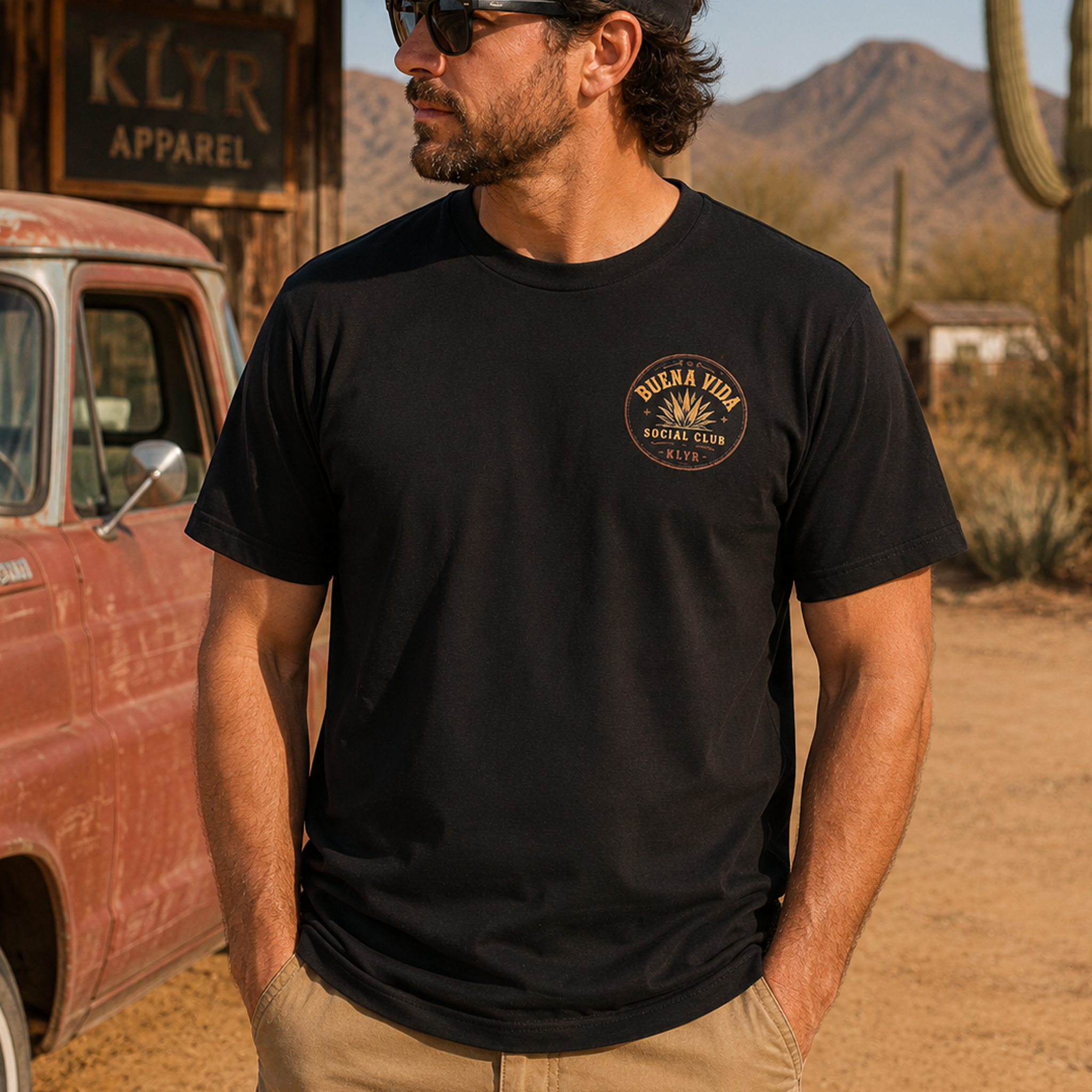 Person wearing the black Buena Vida Social Club Tee with the orange chest logo visible.