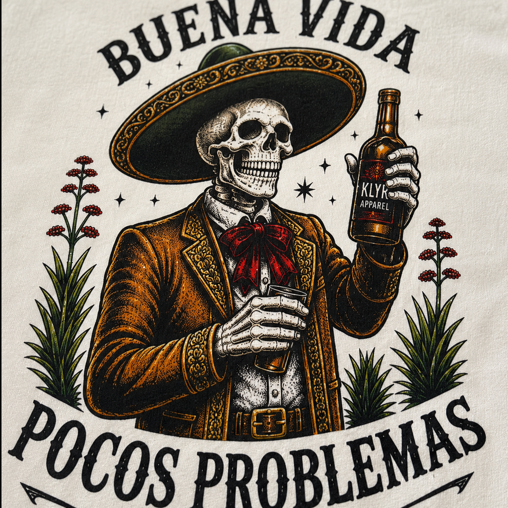 Close-up of the colorful Buena Vida Pocos Problemas artwork used on the white tee.