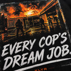 Close-up of the structure-fire artwork and Every Cop's Dream Job graphic on the black KLYR tee. 