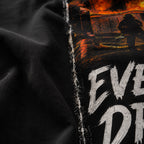Close-up of the black Next Level 6210 CVC fabric and printed artwork on the Every Cop's Dream Job Tee. 