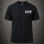 Person wearing the black Every Cop's Dream Job Tee with the white KLYR chest logo visible. 