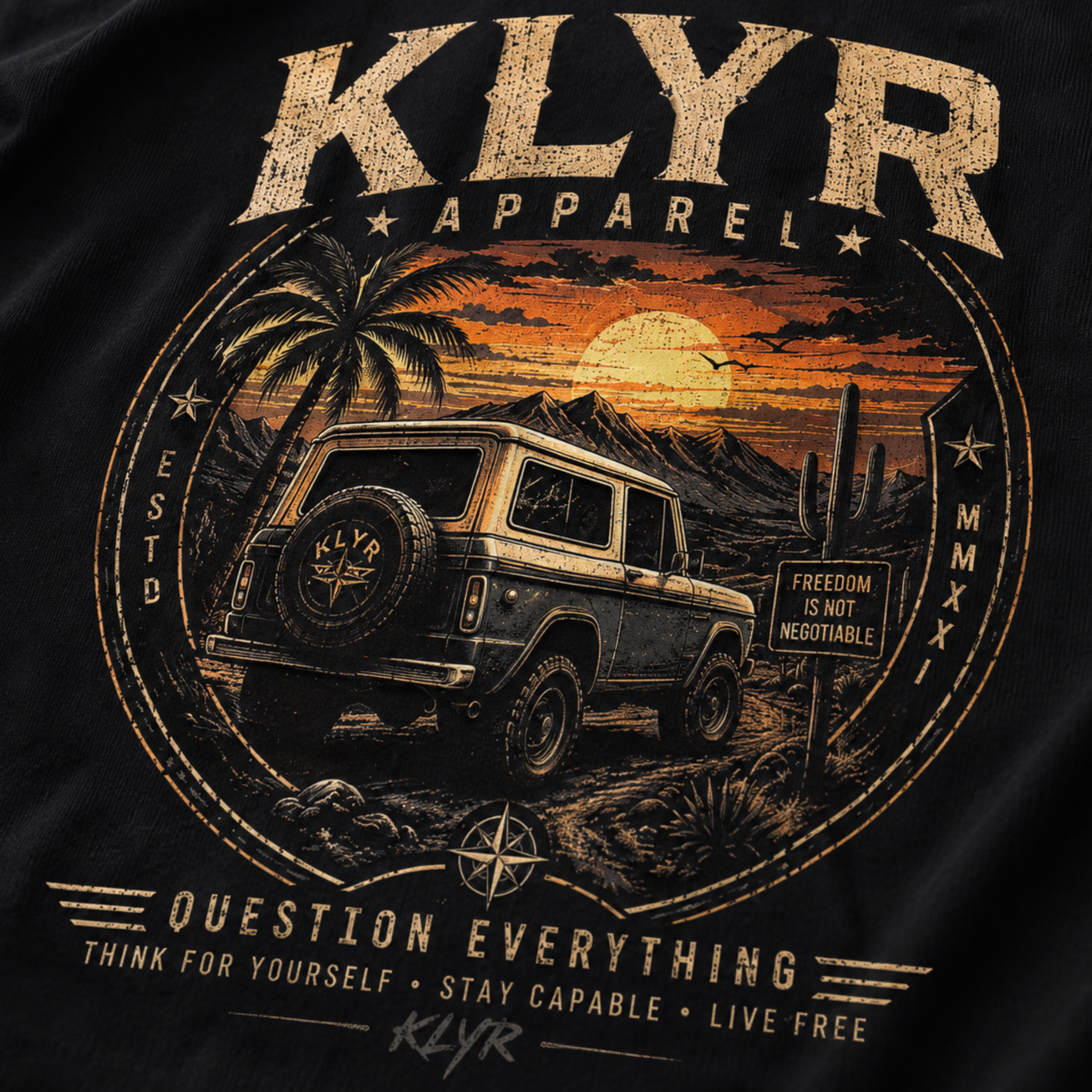 Close-up of the distressed off-road vehicle and desert sunset artwork on the Freedom Is Not Negotiable Tee.