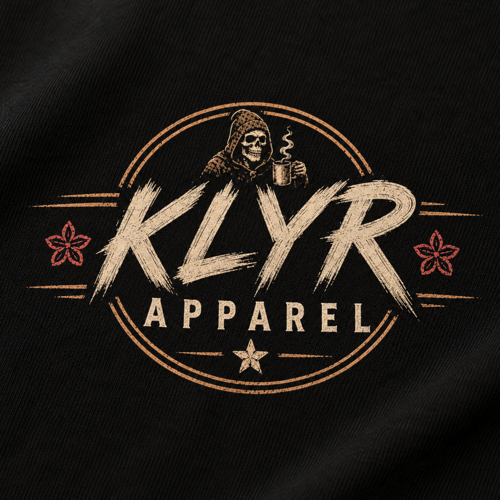 Close-up of the matching KLYR Apparel chest badge on the Fueled by Coffee Tee.