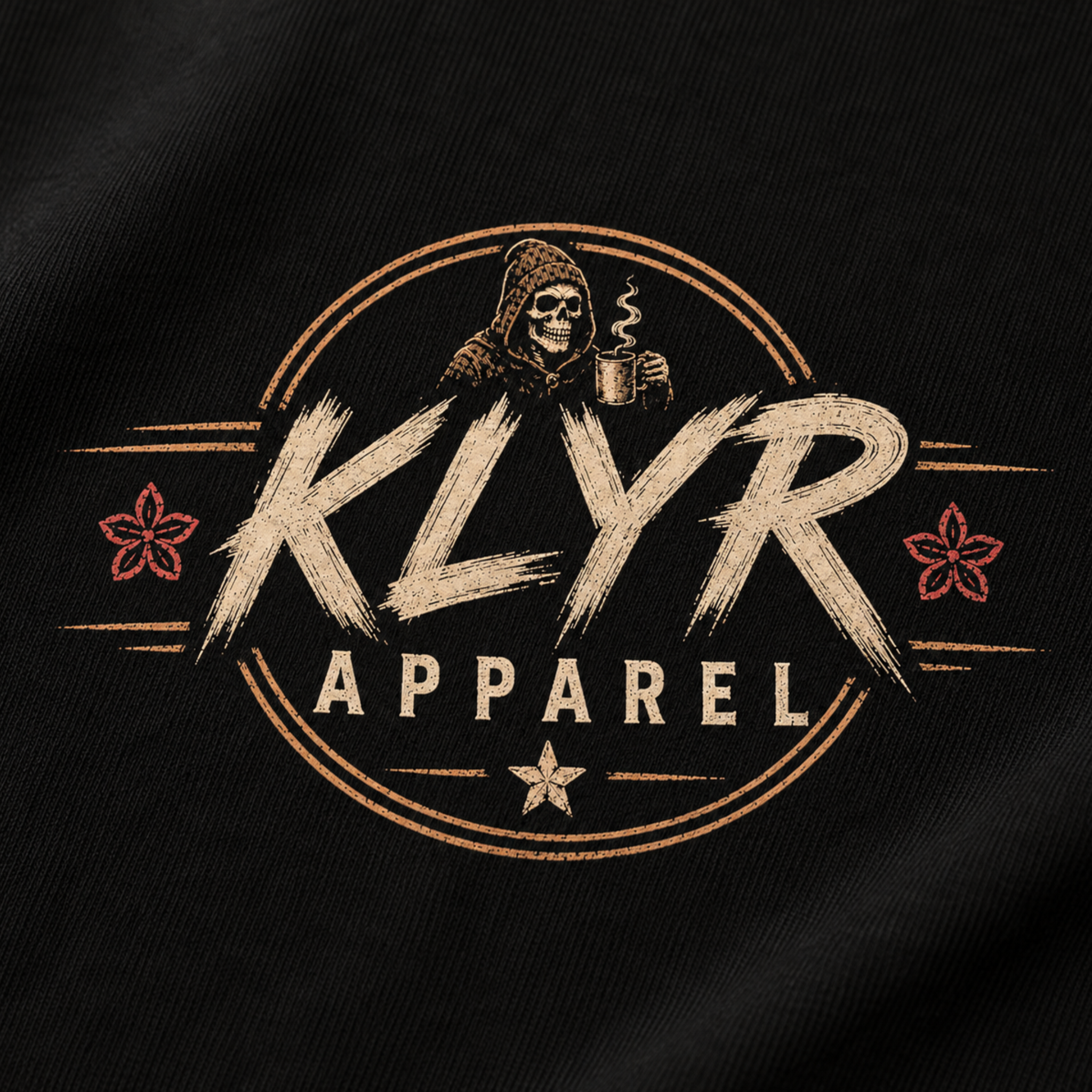Close-up of the matching KLYR Apparel chest badge on the Fueled by Coffee Tee.