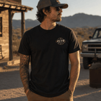 Front view of the black Fueled by Coffee Tee featuring a small matching KLYR chest mark. 