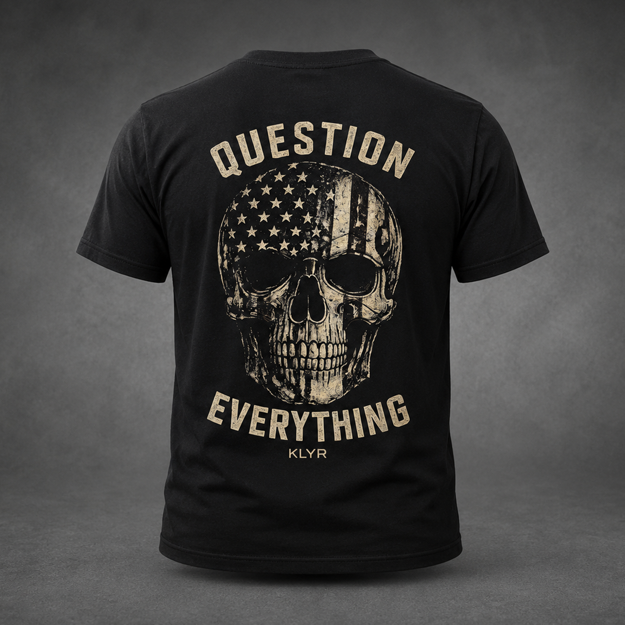 Back view of the black KLYR Independent Tee featuring a distressed American flag skull and Question Everything graphic.