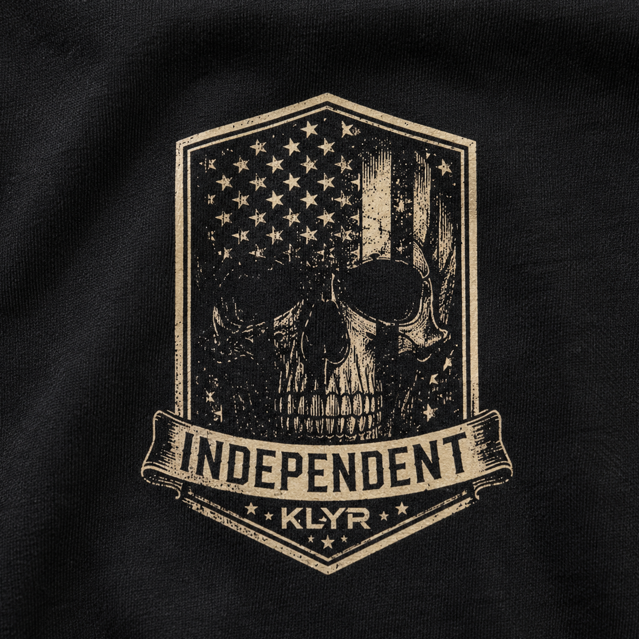 Close-up of the Independent skull chest badge on the KLYR Independent Tee.