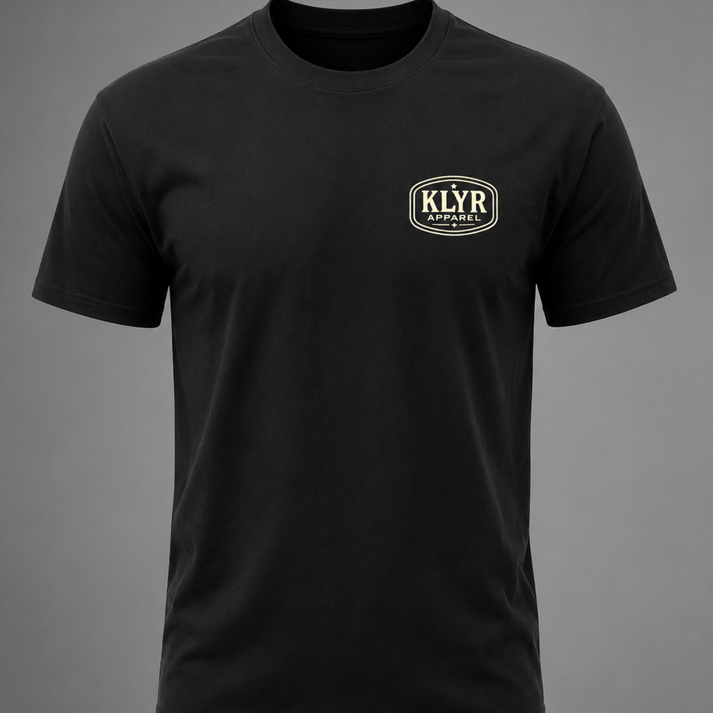 Front view of the black KLYR Last Warning Tee featuring a minimal cream KLYR Apparel chest logo.