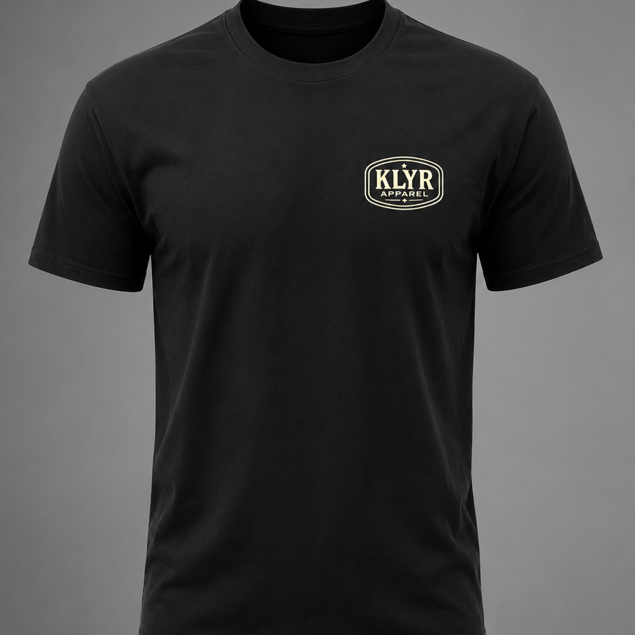 Front view of the black KLYR Last Warning Tee featuring a minimal cream KLYR Apparel chest logo.