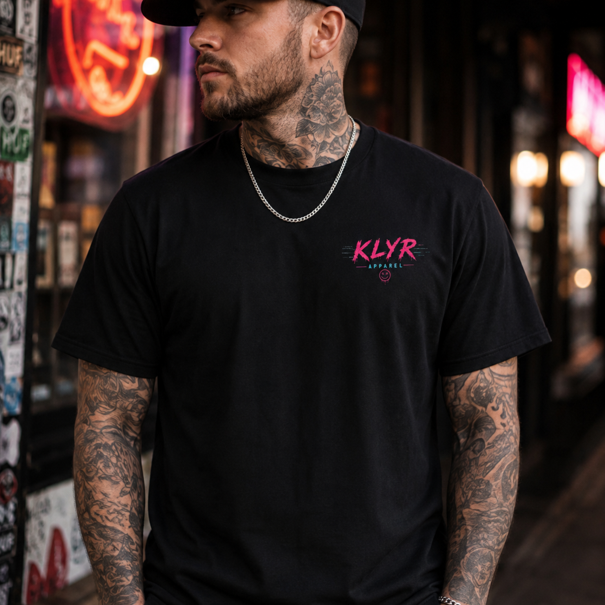 Person wearing the black Reality Glitch Tee with the neon KLYR chest logo visible.