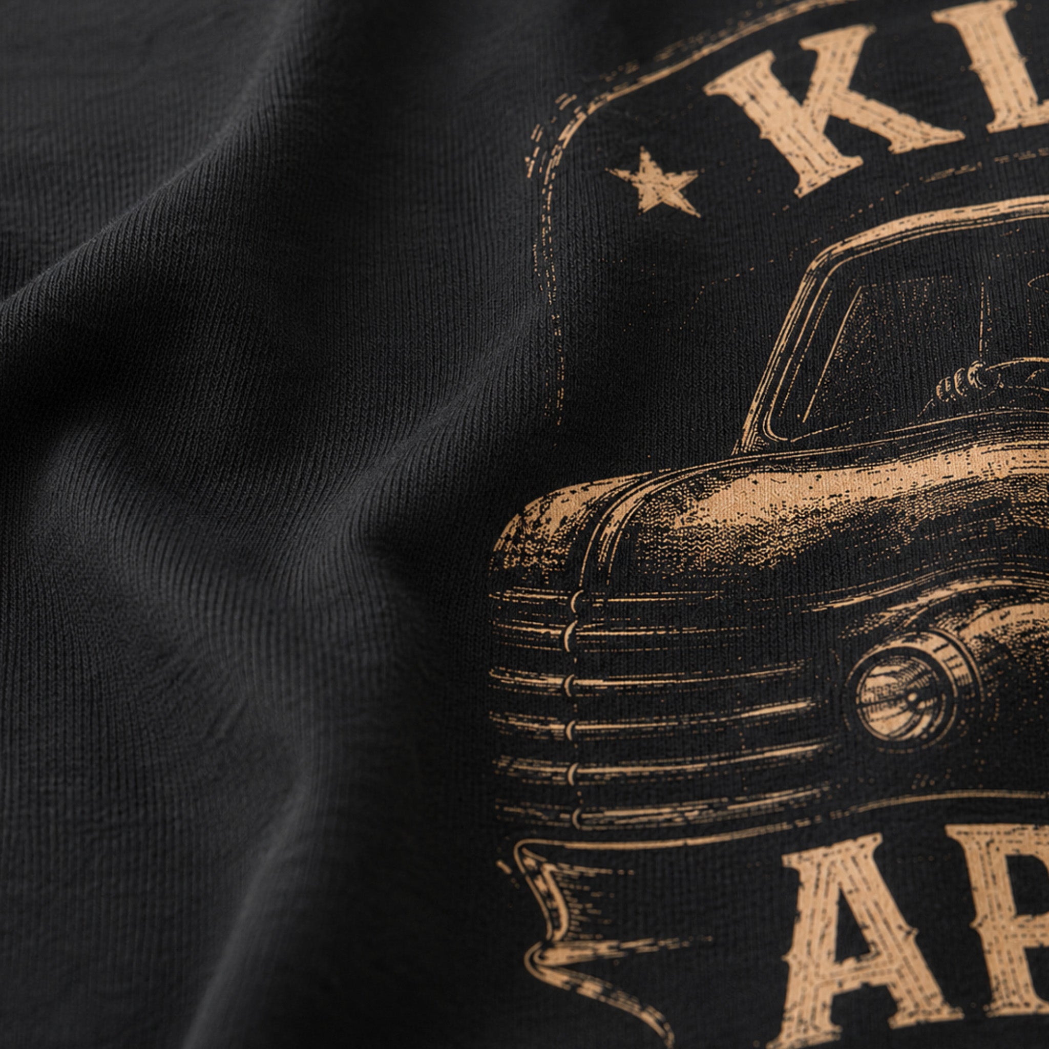 Close-up of the soft black Next Level 6210 fabric and distressed cream print on the Work Hard Stay Humble Tee.