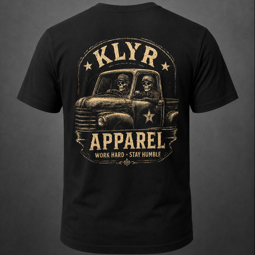 Back view of the black KLYR Work Hard Stay Humble Tee featuring skeletons riding in a vintage pickup truck.
