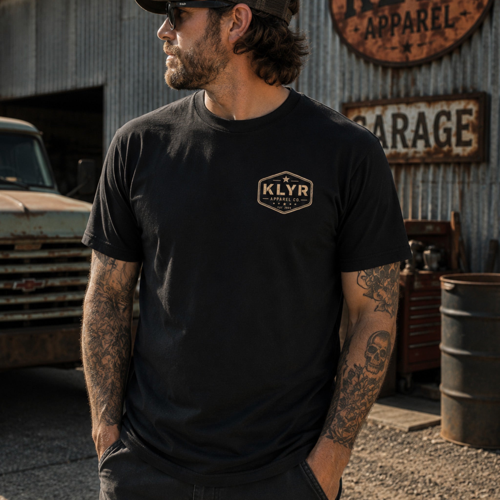Person wearing the black Work Hard Stay Humble Tee with the heritage KLYR chest badge visible.